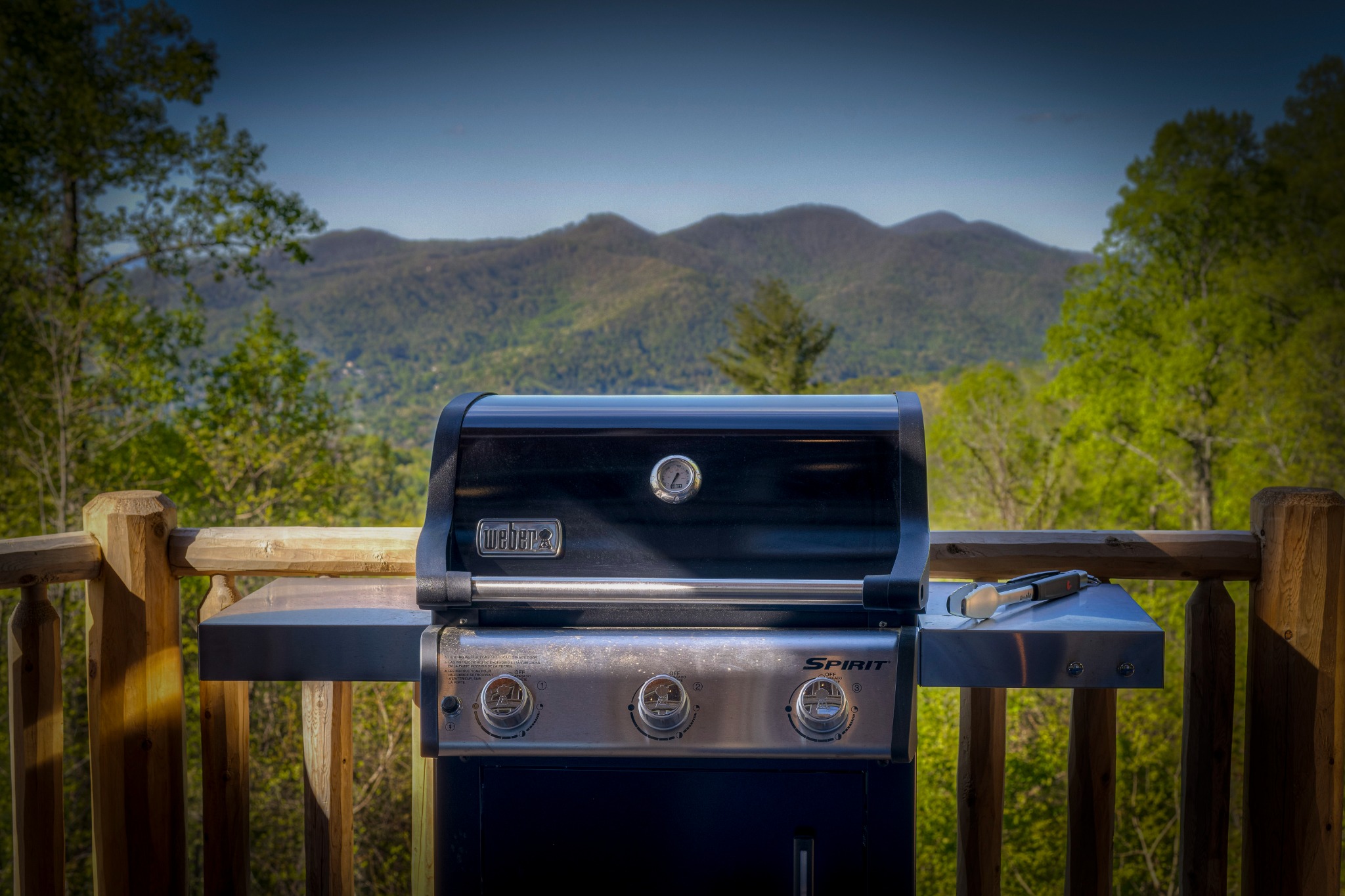 Grilling with a view · Prepare a meal on the outdoor grill while taking in the mountain ridgeline beyond the deck.