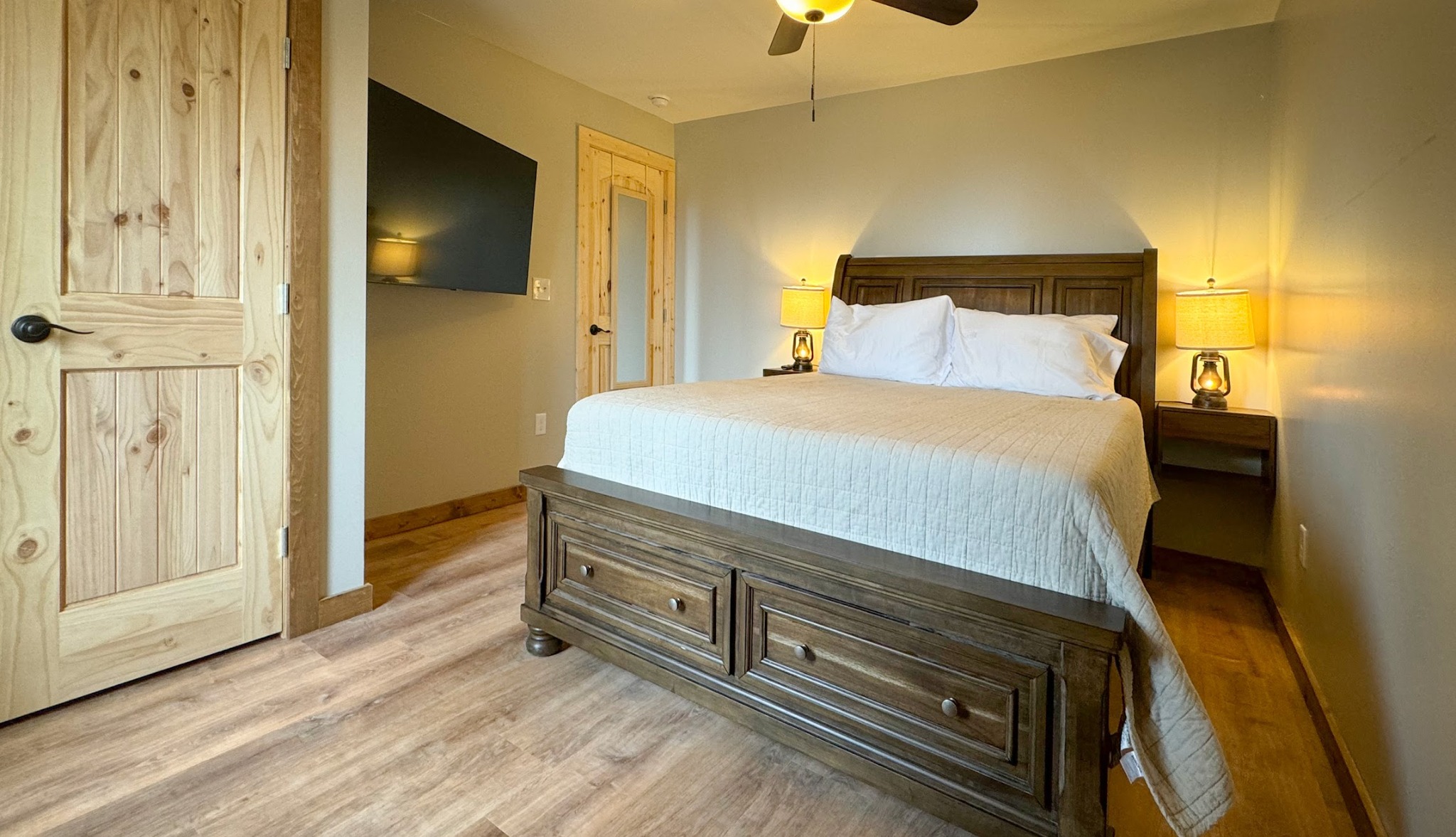Bedroom 4 · Wood furnishings and bedside lighting