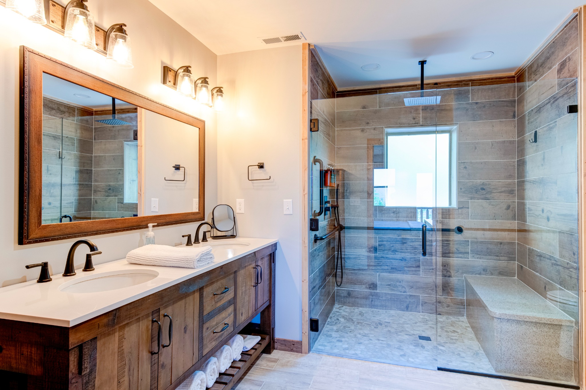 Main-floor suite bathroom · Double vanity and roll-in shower