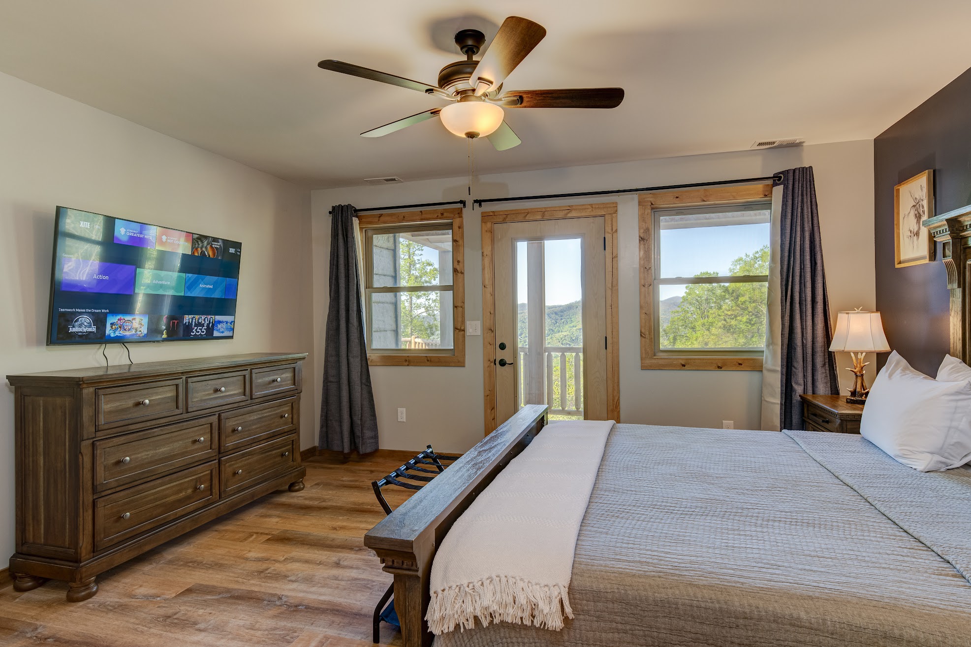 Bedroom 1 · Main-floor king suite · Television and deck doors