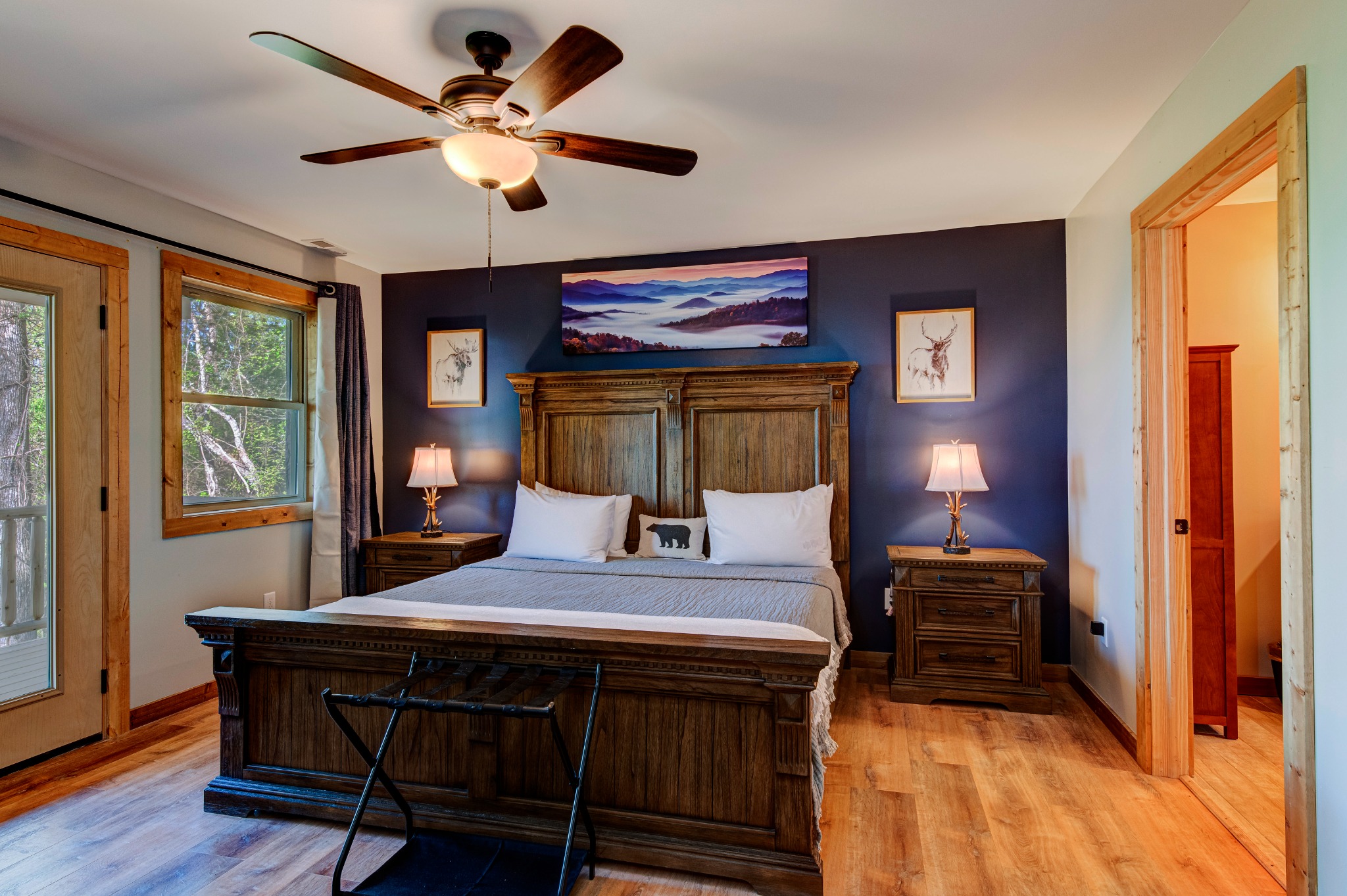 Bedroom 1 · Main-floor king suite · A bedroom opening onto the deck